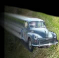 Mrs Moss drives Morris Minor into a ditch