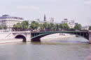 Paris is small: no corner is farther than six miles from the square in front of Notre-Dame Cathedral. The city has a total area of 41 square miles (105 square kilometres), if the two big parks at either extremity are included, and 34 square miles without them. The city occupies a bowl hollowed out by the Seine in its prehistoric vigour, and the surrounding heights have been respected as the limits of the city. The river arches through the center of town, visiting 10 of the 20 arrondissements. Entering the city at the southeast corner, it arcs northward and bends out of Paris at the southwest corner. As a result, what starts out as the streams east bank becomes its north bank and ends as the west bank, and the Parisians therefore adopted the simple, unchanging designation of Right and Left Bank (when facing downstream). These terms are not much used in conversation, as specific places are usually indicated by arrondissement (e.g., quinzième) or by quartier (e.g., Observatoire). 